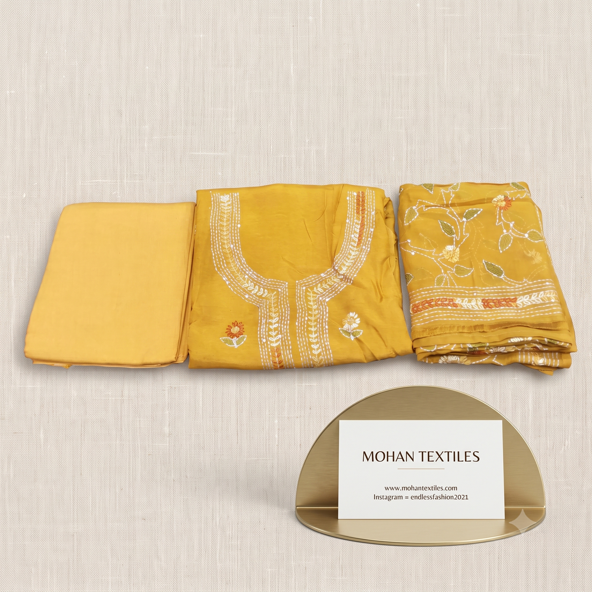 Mustard yellow Phulkari festive muslin unstitched salwar suit material with sheer dupatta by Mohan Textiles.