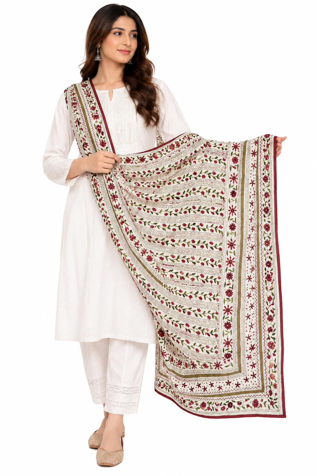 A woman modeling a white traditional outfit with a large embroidered dupatta featuring red and green floral patterns and borders, set against a plain white background.