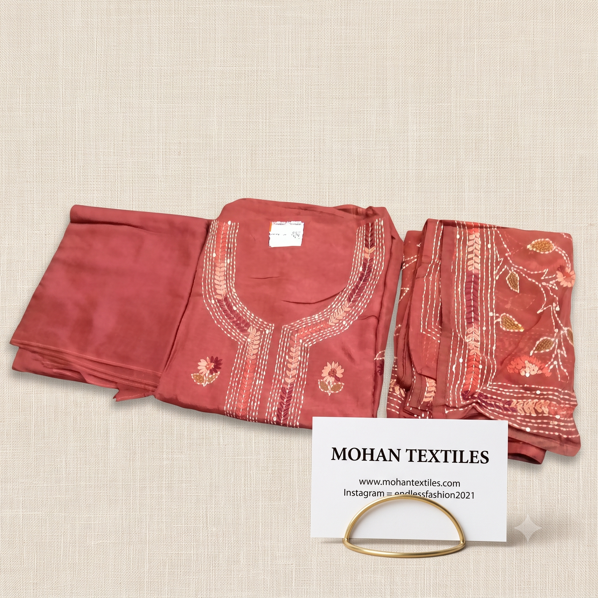 Rust unstitched muslin suit with embroidered neckline and dupatta by Mohan Textiles
