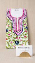 A folded white kurta with vibrant pink, green, and blue floral embroidery, displayed on a beige textured background with a Mohan Textiles business card.
