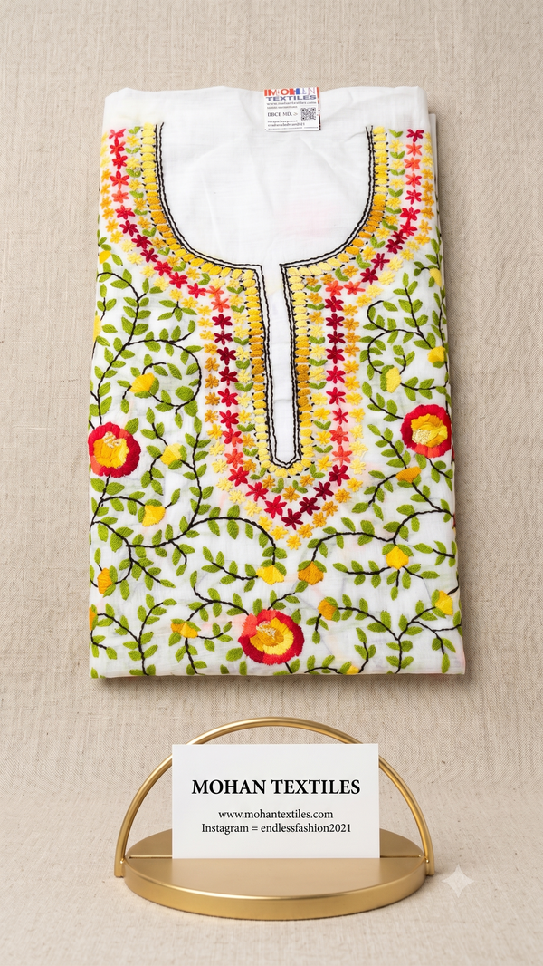 White cotton unstitched Phulkari kurti material featuring vibrant multicolour floral vine embroidery and detailed neckline work.