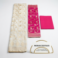 Flat lay of White & Pink unstitched Banarasi style party wear dress material, featuring intricate gold zari floral weaving and a matching dupatta, available at Mohan Textiles.
